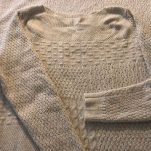 Oatmeal colored sweater.